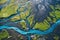 Aerial view of a river in Iceland, seen from a helicopter. Aerial view from above on a green and blue glacier river stream in