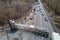 Aerial view of road accident with overturned truck blocking traffic