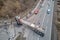 Aerial view of road accident with overturned truck blocking traffic