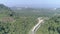 Aerial view of road among beautiful rain forest