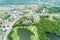 Aerial View of road curve around Village with many Residential Houses Drone shot from Above