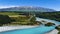 Aerial view with road of highway as bridge at Rakaia River lagoon Valley as green field againts with blue sky