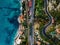 Aerial view of road, highway and railway going along ocean or sea. Drone photography in rural Italy