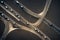 Aerial view of road interchange or highway intersection with busy urban speeding traffic abstract background. Junction