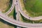 Aerial view of road interchange or highway intersection with busy urban traffic