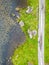 Aerial view of road and lake at Gap of Dunloe with rocks and vegetation