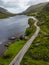 Aerial view of road and lake at Gap of Dunloe with rocks and vegetation