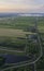 Aerial view of road leading through peat excavation meadow landscape in the netherlands