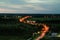 Aerial view Road with long exposure. The expressway in suburbs. Beautiful Street with forest from its sides , Top view