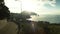 Aerial view on road by the sea and dramatic sky with sunset, lonely rock background. Shot. Sunset over the Highway in