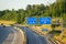 Aerial view of road signs showing directions to Dortmund and Bochum on a sunny day