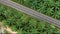 Aerial view of road through tropical nature in Thailand