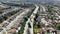 Aerial view of road in typical suburban neighborhood with big villas next to each other, San Diego