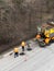 Aerial view of road workers repair asphalt covering. Teamwork concept