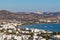 Aerial view with roads, beaches, cliffs and houses in Adamas village