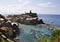 Aerial view on rock above the sea of picturesque Vernazza village resort from Cinque Terre in Italy