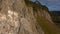 Aerial view of the rock with bird nests. Majestic cliffs, hills, mountains and plains.