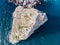 Aerial view of rock cliff Diva in Simeiz sea resort beach in Crimea, drone shot. Beautiful summer vacation nature landscape