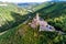 aerial view rock with medieval castle Ehrenburg on it near moselle river in Brodenbach with forest hills