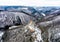 Aerial view rock with medieval castle on it near moselle river in Brodenbach winter with forest snow in the background