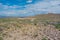 Aerial view rock mountains in the high desert in the middle of the highway of Arizona