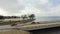 Aerial view rock wall shoreline lakefront and Two Mile Bridge over Lake Tawakoni to horizontal line in Quinlan, Texas