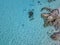 Aerial view of rocks on the sea. Overview of seabed seen from above, transparent water