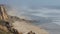 Aerial view of the rocky beach of Nazare with flowing sea water