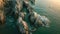 Aerial View of Rocky Coastline With Blue Water, Overhead panorama of the dusk hued sea wrapped around rocky protrusions