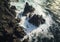 Aerial view of rocky coastline. Waves hitting in rocks. Birds eye view of the sea, cinimatic sea and moutain view. AI Generative