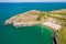 Aerial view of a rocky headland and beautiful sandy beach in West Wales Mwnt, Ceredigion