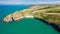 Aerial view of a rocky headland and beautiful sandy beach in West Wales Mwnt, Ceredigion