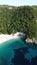 Aerial view of the rocky shoreline of Corfu, Greece with its crystal clear blue ocean waters.