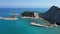 Aerial view of the rocky shoreline of Corfu, Greece with its crystal clear blue ocean waters.