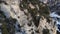 Aerial view of a rocky wall in the mountains covered with juniper. Footage of a rare endangered plant in the highlands