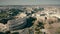 Aerial view of Roman cityscape involving famous Colosseum amphitheatre, Italy