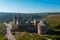 Aerial view of the romantic stone medievel castle on top of the mountain