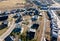 Aerial view of the roofs of country modern houses. Cottages, townhouses and line houses. Construction of modern residential