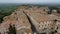 Aerial view of the roofs of Montepulciano and the surrounding countryside, in 4K