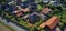 Aerial view of the roofs of a single-family house settlement on the edge of the country road of a German suburb