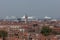 Aerial view of the roofs of Venice with the profile of large cruise ships behind