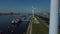 Aerial view of rotating wind turbines in the port of rotterdam