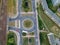 Aerial view on roundabout intersection with cars traffic and railroad