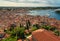 Aerial view of Rovinj, lagoons of Istrian Peninsula, red tiled roofs of historical buildings, sailboats, piers, cityscape, Croatia