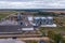 aerial view on rows of agro silos granary elevator with seeds cleaning line on agro-processing manufacturing plant for processing