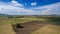 Aerial view rows of soil before planting. Baby cassava or manioc plant farm pattern in a plowed field prepared. agriculture field,