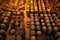 aerial view of rows of wooden barrels in storage