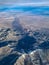 Aerial view of rugged mountainous terrain East of Los Angeles California in winter with snow capped peaks.