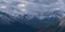 Aerial view of rugged Sundance Range in the Rocky Mountains near Canmore, Alberta, Canada with snow-capped Mount Turbulent viewed