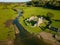 Aerial view of a ruined Norman era castle in a rural area Ogmore Castle, Wales